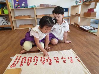 mathematics cards and counters with friends sharing